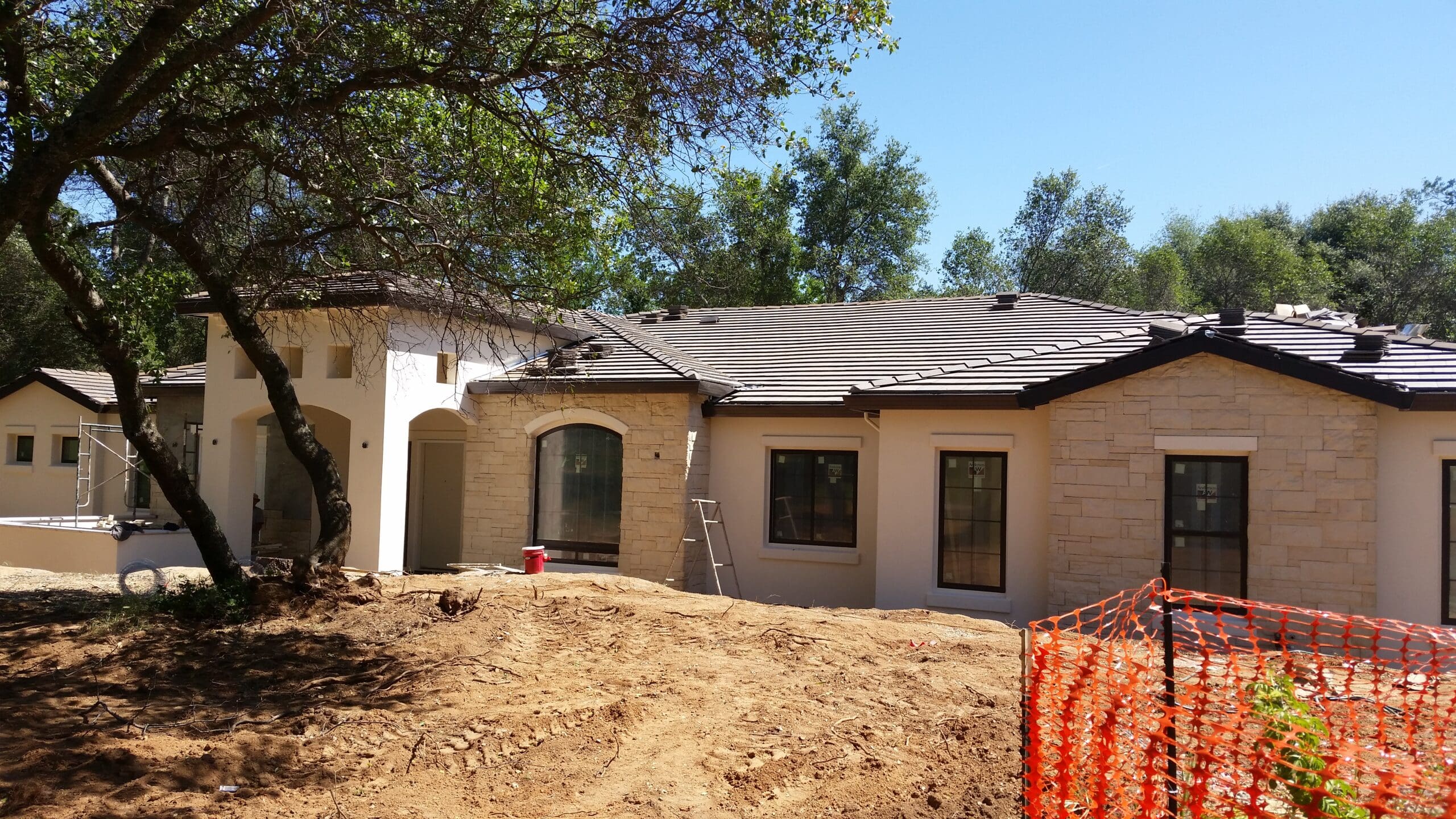 Utility trenching and electrical service installation on a Texas Hill Country building site