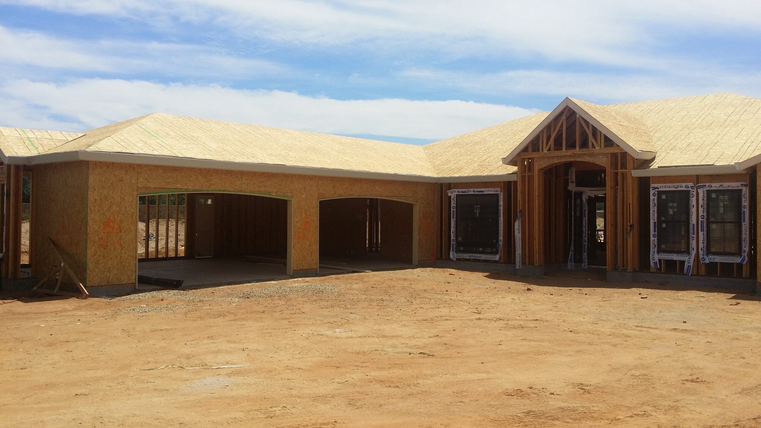 Septic system installation on a rural Texas Hill Country home site with limestone soil.