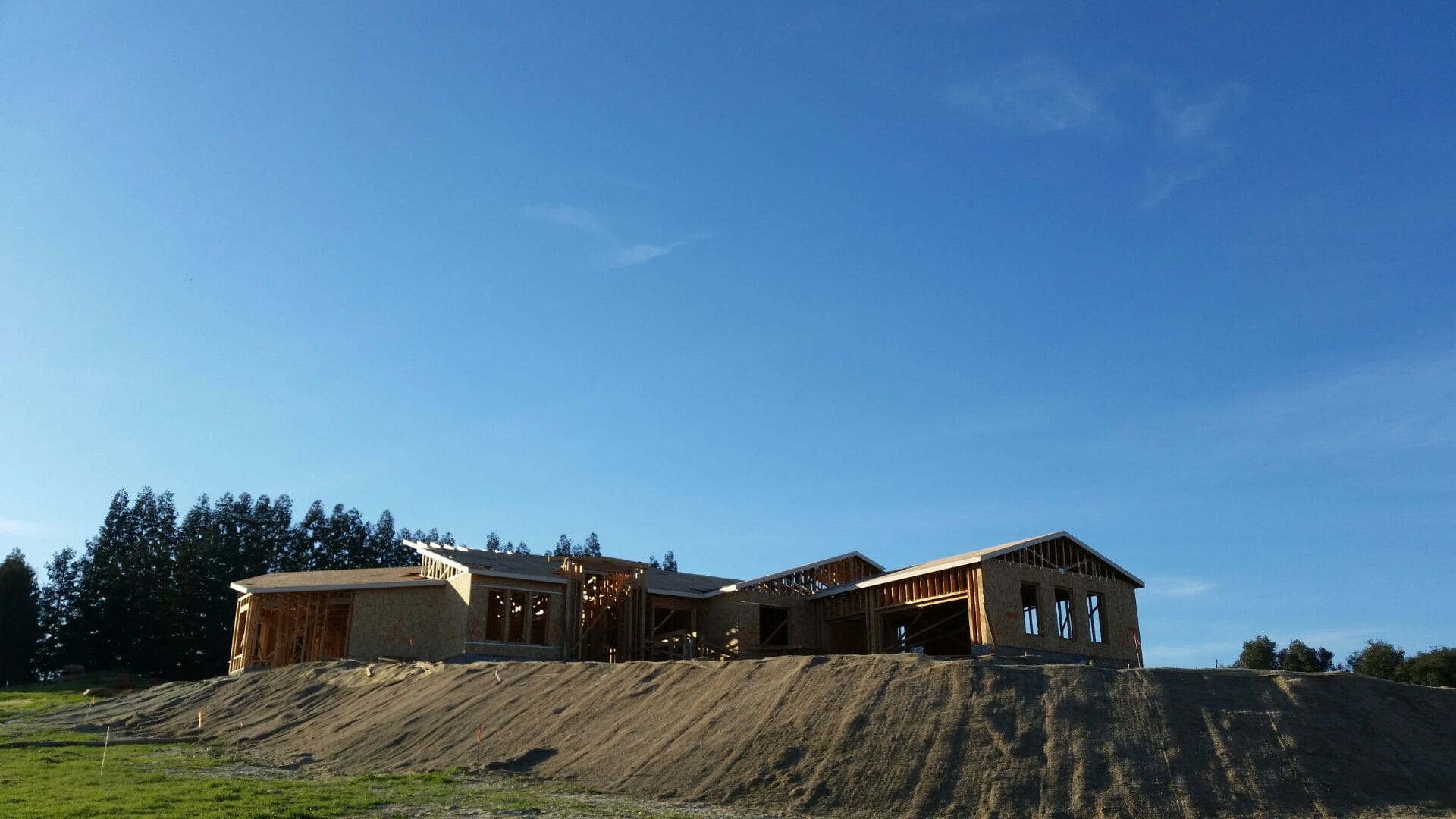 Excavation and foundation work on a rocky Texas Hill Country home site